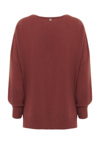 Maglione overdimensionato color marrone scuro realizzato in tessuto a maglia, con scollatura rotonda, polsini a coste e orlo a coste con un piccolo dettaglio etichetta sul retro.