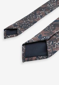 Next Solmio - neutral brown