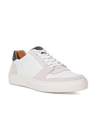 Light gray and white sneaker with a suede and leather upper, textured rubber sole, lace-up closure, and subtle perforations on the toe.