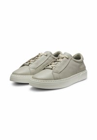 Light grey leather sneakers with a rounded toe, tonal laces, and a textured rubber sole. Features minimal stitching and a sleek design.