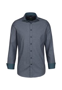 Camicia a maniche lunghe da uomo in tessuto blu navy con motivo a pois, caratterizzata da un polsino teal a contrasto e un colletto standard con chiusura a bottoni.