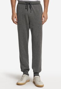 Grå joggerbyxor i mjukt tyg, med elastisk midja med dragsko, ribbade mudd och sidofickor.