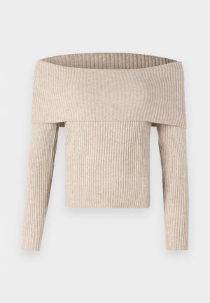 Beežikas soonikkoes õlgadest paljastav pikkade varrukatega kampsun, millel on lai voltkaelus ja keha järgnev siluett.