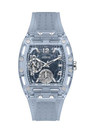 Διαφανές μπλε ρολόι Guess με τετράγωνο καντράν, ασημένιους δείκτες ώρας, δύο υποκαντράν και λουράκι σιλικόνης με ραφές.