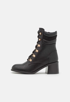 Bottines à lacets - black