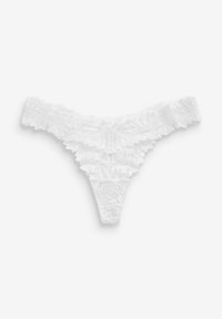 String en dentelle blanche avec des bords volants, présentant des motifs floraux et une texture délicate. Taille fine avec un design à couverture minimale.