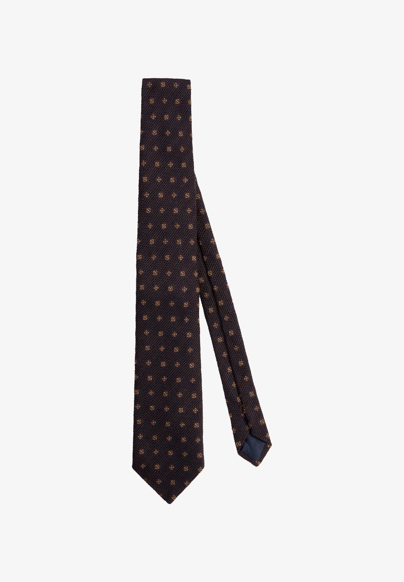 Marineblauwe stropdas van een gestructureerde stof met een herhalend geometrisch patroon in goud. Gelijnde punt met een spitse eind.