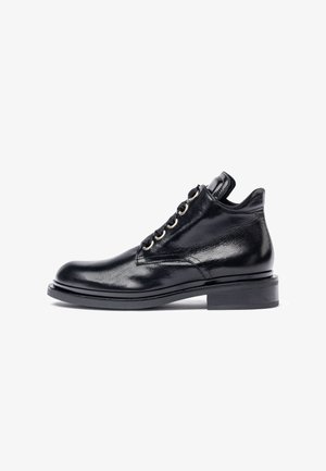 Black leather ankle boots with a polished finish, round toe, metal eyelets, lacing, and a stacked heel. Smooth texture and classic design.