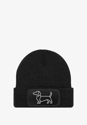 Black knit beanie with a cuff; features a rectangular patch displaying a white outline of a dachshund. Durable fabric with textured weave.