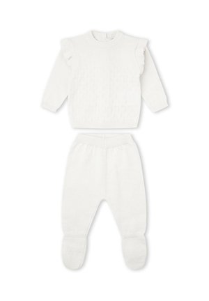 Conjunto para bebé tejido en blanco con camiseta de manga larga con detalles de volantes y pantalones con pies a juego.