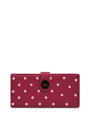 Pink leather wallet featuring white polka dots and a circular black snap closure with a logo. Rectangular design with smooth texture.