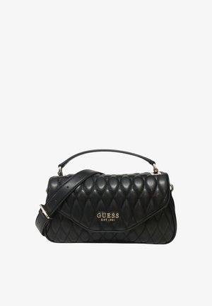 Sac à main noir matelassé en simili cuir, doté d'une forme structurée, d'un logo doré "GUESS EST 1981" et d'une bandoulière adjustable.