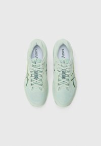 Light green athletic shoes with a textured mesh upper, laces, and distinctive Asics logo in navy. Features minimal accents for a streamlined design.