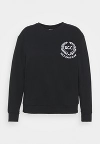 Felpa nera in cotone con scollo rotondo, caratterizzata da ricamo bianco con il testo "S.C.C." e "SELF CARE CLUB" all'interno di un design con alloro.