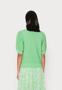 Cream Strickpullover - green