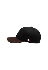 Black cap with a brown suede brim. Features a logo on the front and three vertical stripes in blue, white, and red on the side.