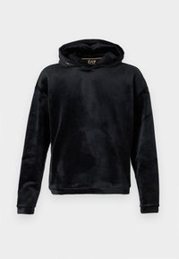 Felpa nera realizzata in morbido tessuto peluche con vestibilità ampia. Presenta un ampio scollo, maniche lunghe e un sottile dettaglio del logo sul colletto.