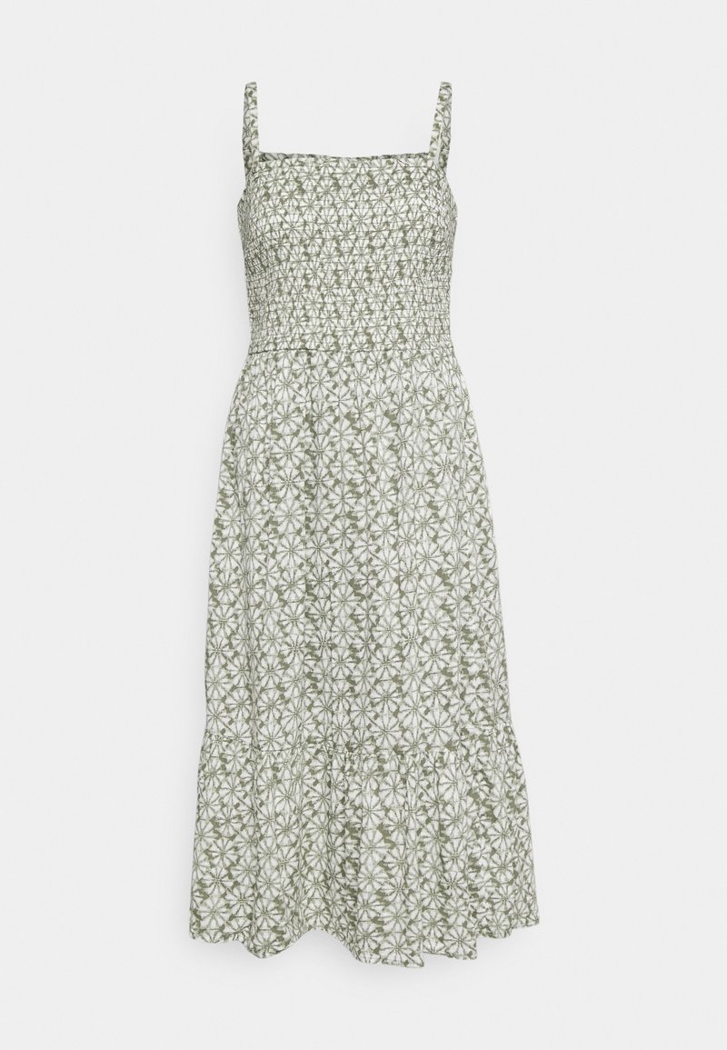 Robe midi sans manches avec encolure carrée et corsage froncé, présentant un motif floral vert et blanc et une jupe à volants.