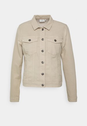 Beige farmerdzseki, nyakkal, két mellzsebbel és fekete gombzárral. Kidolgozott részletek és testhez simuló fazon jellemzi.
