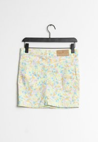 Short pastel skirt with a geometric pattern in yellow, blue, and peach. Features two back pockets and a leather patch on the waistband.