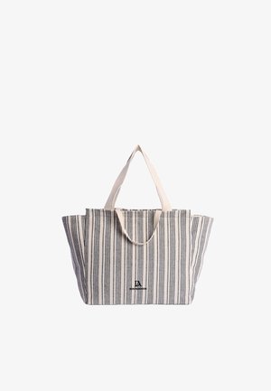 Bolso tote con rayas verticales beige y negras, con dos asas beige y un pequeño logo "Don Algodon" en el centro delantero.