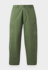 Cargo pants in olive green cotton. Features include wide legs, two large front pockets, and reinforced side utility pocket. Flat waistband with button.