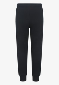 Svarta sweatpants med elastisk midja, smalnande ben och ribbad mudd. Tillverkade av mjukt, slätt tyg utan synliga logotyper eller mönster.