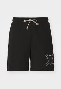 Pantalones cortos de algodón negros con una cintura elástica y cordón. Presenta un bordado en gris de una calavera y huesos cruzados en el lado inferior.