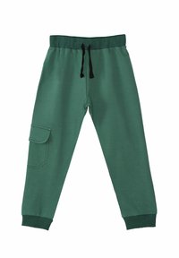 Grüne Sweatpants aus weichem Material mit einem Kordelzugbund und einer Seitentasche. Mit gerippten Bündchen und kontrastierenden Nähten.