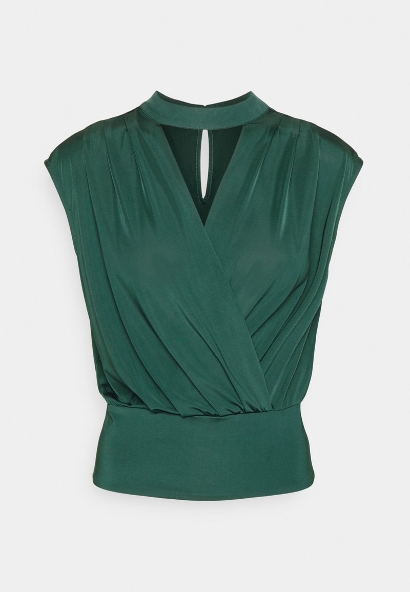 Blouse sans manches vert foncé avec tissu froncé, encolure en trou de serrure et taille cintrée.