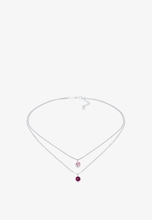 Sølv dobbeltlaget halskæde med to cirkulære vedhæng: et klart og et dyb pink. Elegant kædesign, glat tekstur og justerbar længde.