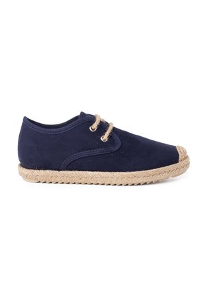 Navy blue shoe with a suede upper, rounded toe, rope-style sole, and two natural-colored laces threaded through eyelets.