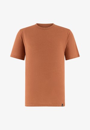 T-shirt unie couleur rouille, manches courtes, col rond, avec une petite étiquette noire en bas à gauche, présenté sur un fond blanc.