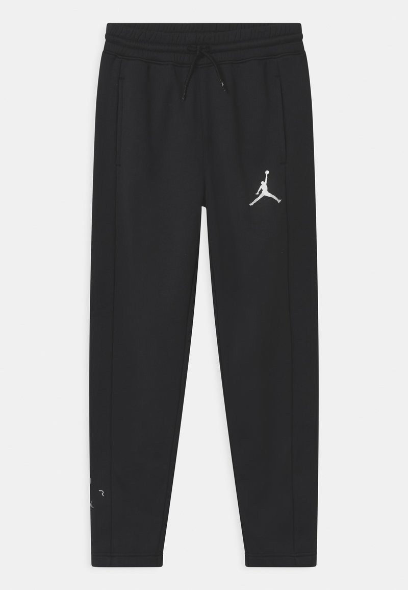 Black jogger pants made of soft fabric, featuring side pockets and an adjustable waistband. Includes a white Jumpman logo detail.