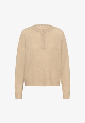 Bežinis megztinis su apvalia iškirpte, sagų eilute su skaidriais mygtukais ir raukšlėtais rankogaliais bei apačia. Minkšta tekstūra, laisvas siluetas.