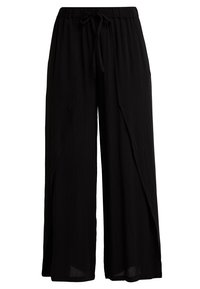Pantalon noir à jambe large en tissu léger, avec une taille élastique et un cordon de serrage, offrant une coupe décontractée et un design drapé.