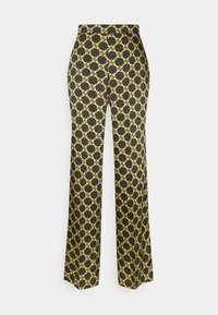 Černé kalhoty s vysokým pasem a rovnými nohavicemi, které mají opakující se vzor zlatého ŘETĚZU.