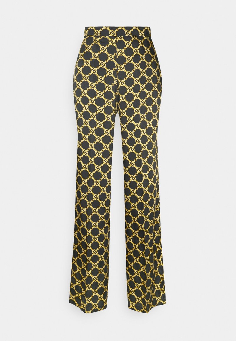 Černé kalhoty s vysokým pasem a rovnými nohavicemi, které mají opakující se vzor zlatého ŘETĚZU.