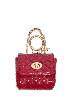 Small shiny red quilted handbag with gold chain strap and oval turn-lock clasp on front flap.