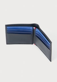 Black leather wallet with blue card slots, featuring a textured finish and red accent stitching along the edge, folded open for visibility.