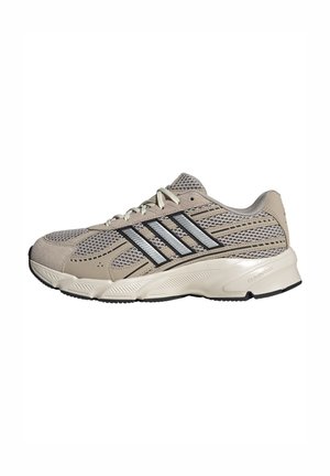 Beige en grijze mesh hardloopschoen met zwart-zilveren gestreept ontwerp, witte veters en een gedempte zool met het label "Cloudfoam."