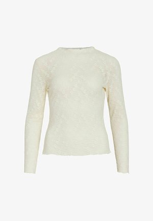 Top in pizzo color crema a maniche lunghe con scollo rotondo e motivo floreale in rilievo. Presenta una silhouette aderente e dettagli con orlo grezzo.