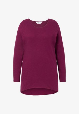 Túnica de manga larga en púrpura profundo, hecha de una tela suave y texturizada. Presenta un escote redondo y un dobladillo ligeramente curvado para una silueta alargada.