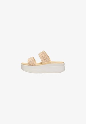 Sandalia tipo slide beige con dos tiras de tela texturizada y una suela blanca gruesa para uso casual femenino.