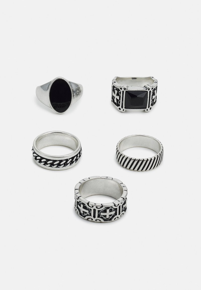 Set of five rings: one silver signet ring with black stone, four metallic bands with various designs, including braided and striped patterns.