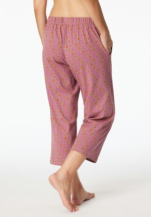 Pink patterned cropped pants featuring a diamond design, elastic waistband, and side pockets. Smooth fabric with a soft texture.