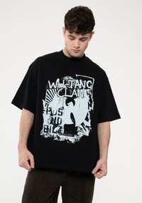 Black oversized T-shirt made of cotton, featuring a distressed light blue Wu-Tang Clan graphic, short sleeves, and a crew neckline.