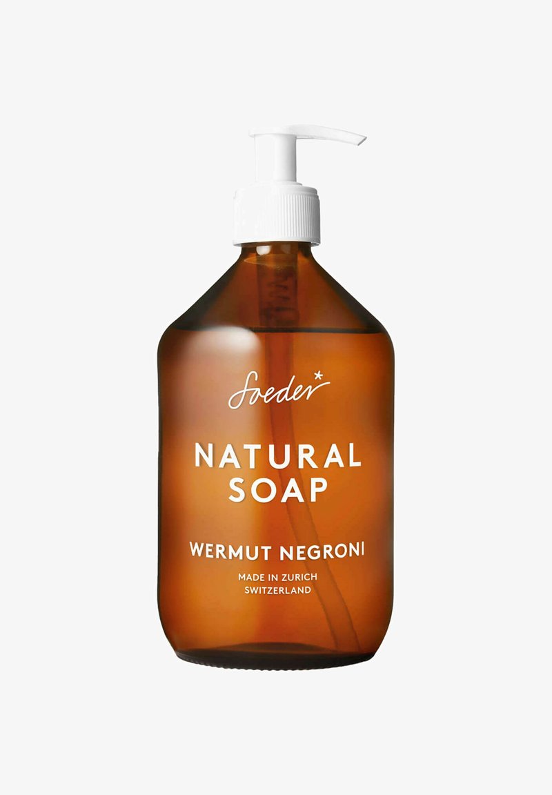 Bottiglia di sapone naturale ambrata con un tappo a pompa bianco. L'etichetta riporta "Sapone Naturale Wermut Negroni" con "Prodotto a Zurigo, Svizzera."