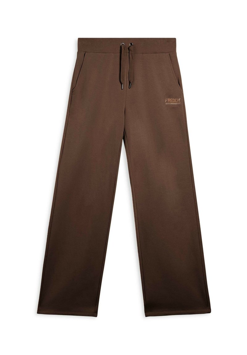 Pantaloni da jogging larghi e marroni realizzati in morbido tessuto. Presentano una vita elasticizzata con cordoncino e tasche laterali. Logo discreto sull'anca.