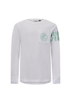 Camisa blanca de manga larga con bolsillo en el pecho delantero que presenta un gráfico de ola y el texto "Retour Paradise Pacific"; texto verde "SURVIV" parcialmente en la manga derecha.